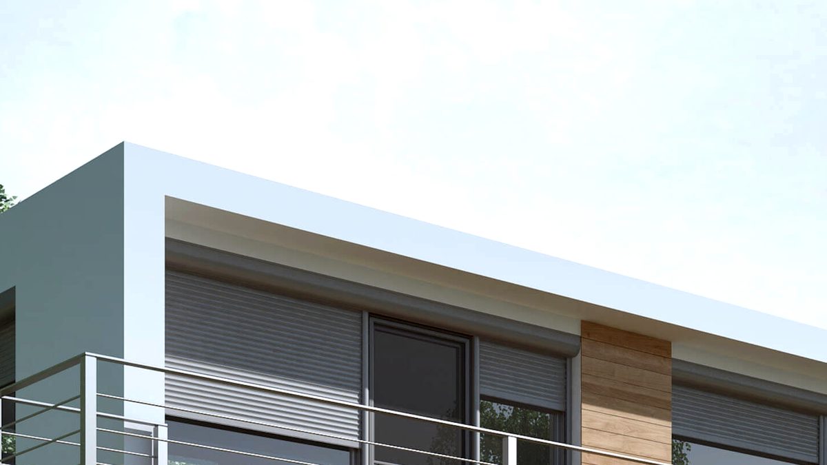 Terrasse en béton desservie par de larges portes-fenêtres aluminium