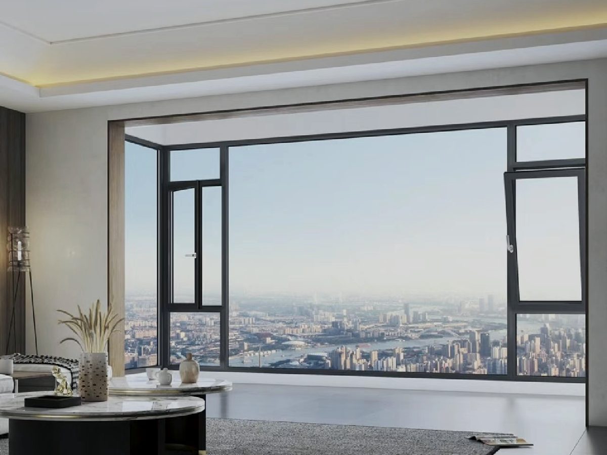 Porte-fenêtre aluminium ouverte sur une terrasse, vue depuis le séjour